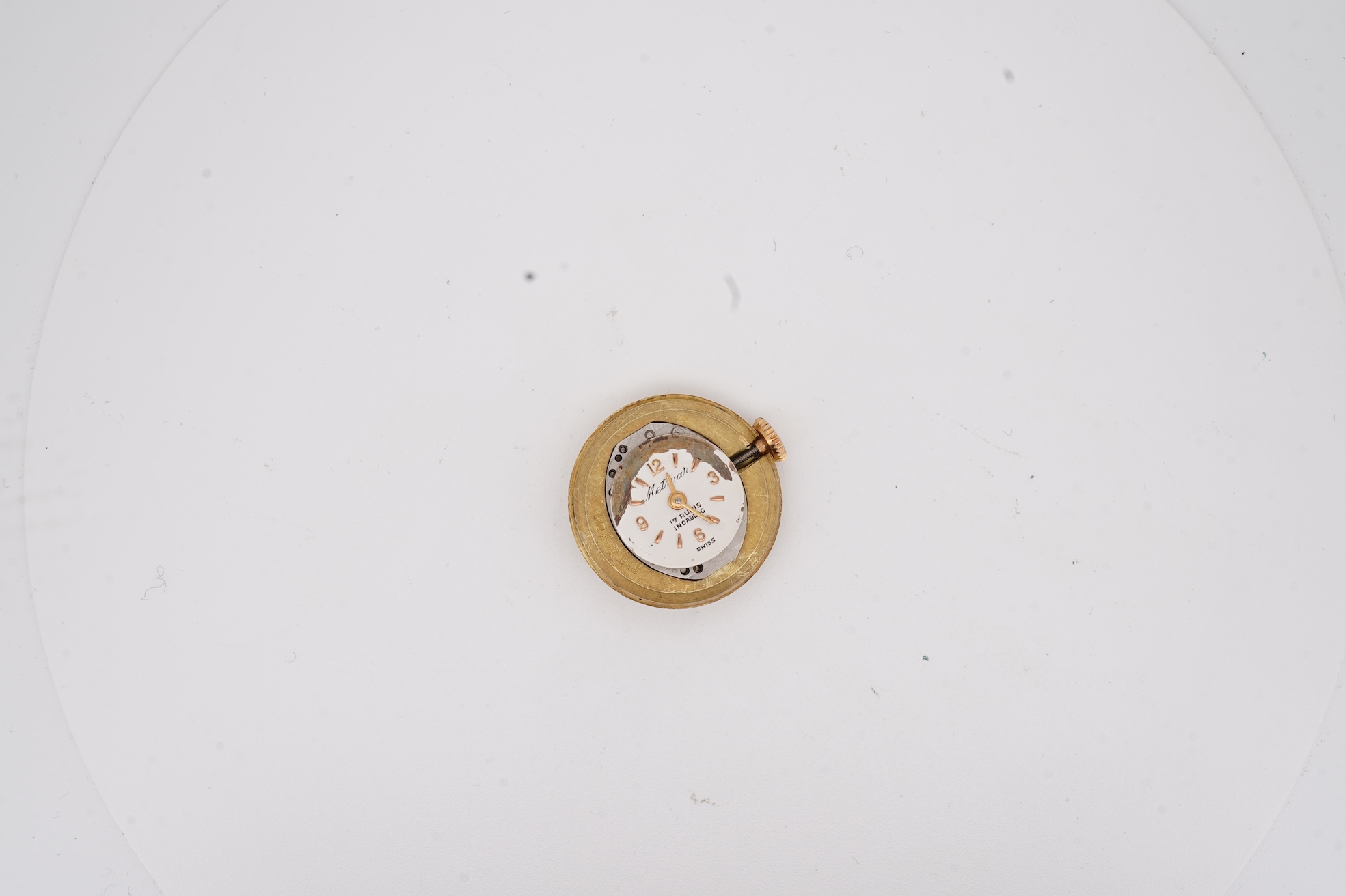 A mid 20th century Italian 18k and enamel fob watch, dial a.f., suspended from and Italian 18k and blue enamelled ribbon bow brooch, brooch width 30mm.